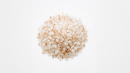 Mound of rough sea salt crystals on a plain white background