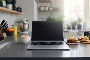 Fototapeta premium Modern kitchen workspace with laptop, breakfast items, and fresh coffee in morning light