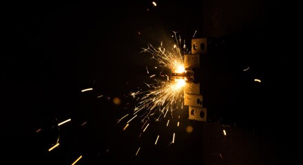 Sparks erupting from a metal object in darkness