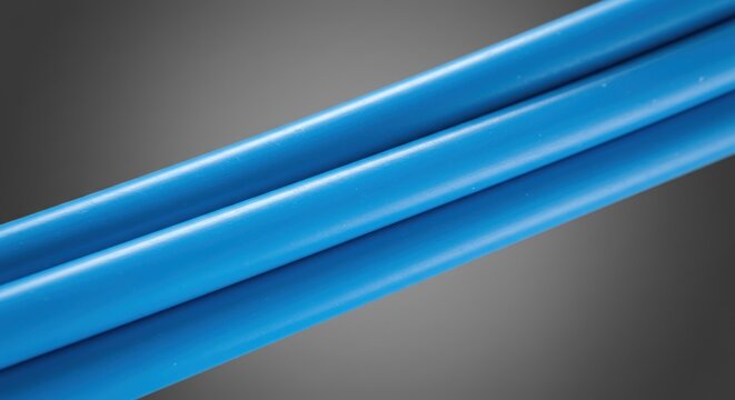 Three thick bright blue tubes bundled together on a grey gradient background