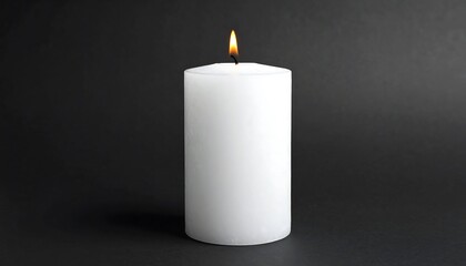 Single white candle on dark background.