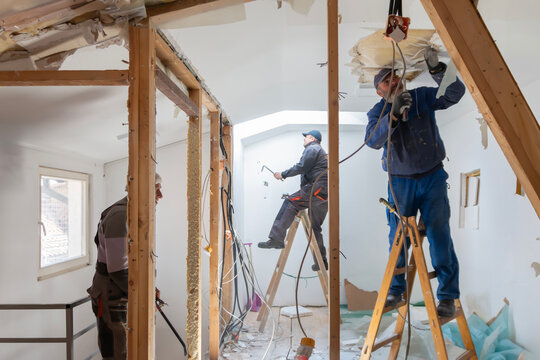 Preparation for renovation in the apartment. Home renovation workers crew. Real construction worker working on a house renovation - authentic person on the job. House improvement concept.
