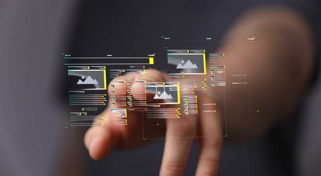 Person interacts with a digital interface, managing and editing images online.  Modern technology.