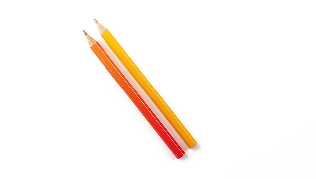 Two colored pencils in orange and yellow with soft shadow for mockup use
