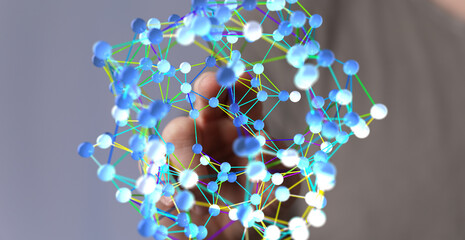 Abstract image of a hand interacting with a network of interconnected nodes, representing data, connections, or relationships.