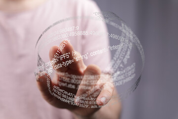 Hand interacting with a transparent sphere showing IPFS code and data. Technology concept.