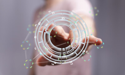 Person interacts with a digital holographic interface showing data analysis and statistics.