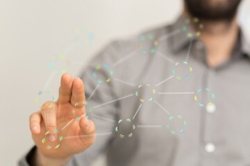 Stock photo of a person interacting with a digital network interface.  Ideal for technology, connection, and networking