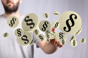 Abstract image of paragraph symbols floating near a person's hand, symbolizing legal concepts.