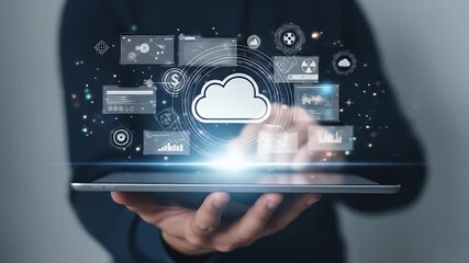 Digital cloud and data interfaces hover over a tablet held by a person - Powered by Adobe