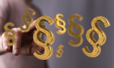 Hand interacting with 3D golden paragraph symbols. Legal, law, justice concept.