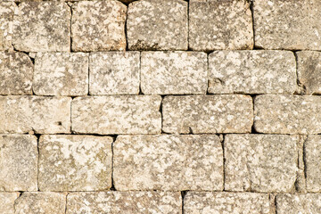 The pattern of rectangular stone blocks in a medieval castle wall architectural detail concept