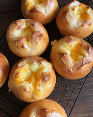 Freshly baked buns filled with melted cheese.