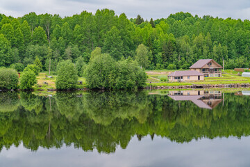 Obraz premium Picturesque landscape with reflection in water