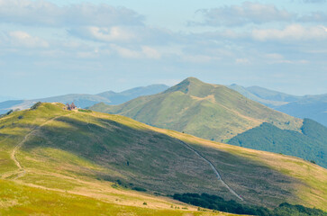 Mountain trail leading to a wooden shelter in the Carpathians