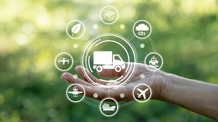 Sustainable logistics concept with hand holding eco-friendly transport icons, green environment