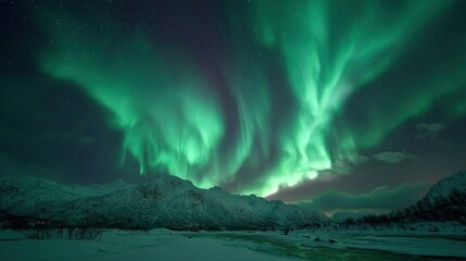 Northern Lights over snowy mountains