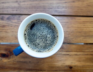 Savor the rich, flavorful coffee in a stylishly crafted mug that rests upon a rustic wooden table