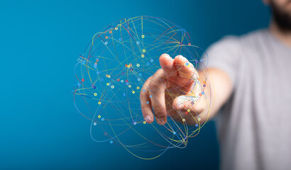 Hand interacting with a digital network, symbolizing global connections and data flow.