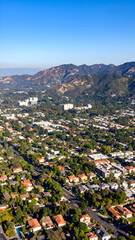 Aerial view with suburban hillside town.