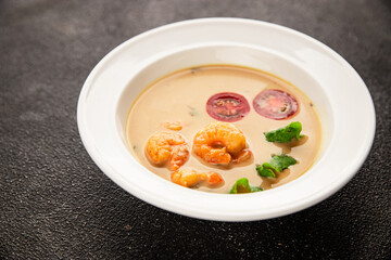 Tom kha soup shrimp, coconut milk, miso paste tasty seafood snack fresh delicious gourmet food background on the table rustic food top view copy space pescetarian diet