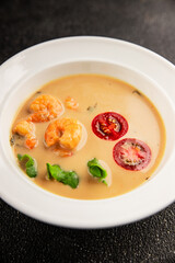 Tom kha soup shrimp, coconut milk, miso paste tasty seafood snack fresh delicious gourmet food background on the table rustic food top view copy space pescetarian diet