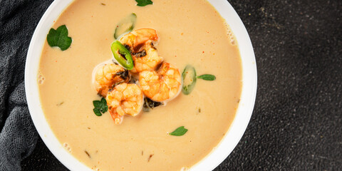 Tom kha soup shrimp, coconut milk, miso paste tasty seafood snack fresh delicious gourmet food background on the table rustic food top view copy space pescetarian diet