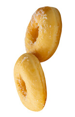 Side view of two brown sugar glazed cinnamon donuts in stack isolated with clipping path in png file format
