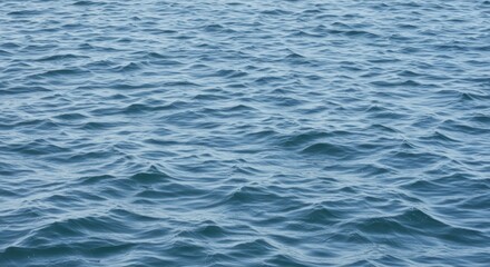 Calm Blue Ocean Water with Ripples and Waves - Peaceful Seascape Background