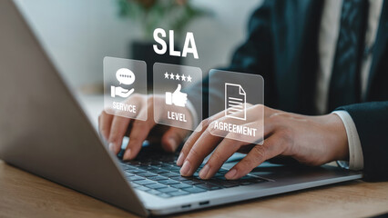 Business professional managing service level agreements and contracts on a laptop for enhanced client satisfaction