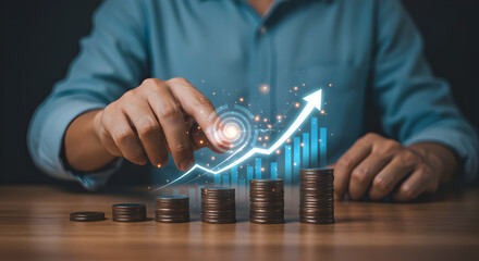 Man touching a futuristic digital interface to start a financial growth plan. Stacks of coins with a rising arrow symbolize setting goals for investment, savings, and future income