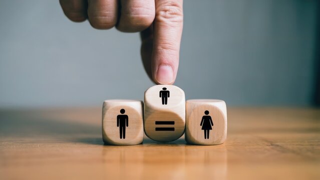 Promoting gender equality in the workplace with wooden blocks and an equal sign conveying inclusivity - Powered by Adobe