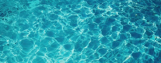 Fototapeta premium Clear blue water with light reflections creating intricate, shimmering patterns on the surface, evoking a refreshing and tranquil atmosphere.