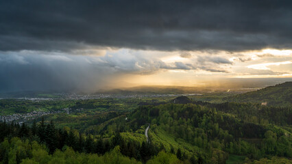 A dramatic and atmospheric view of a rain shower over the Murg Valley in the Northern Black Forest....