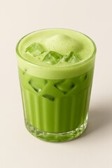 Cool and creamy iced matcha latte with vibrant green color and ice.