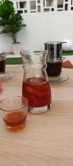 Iced coffee and Vietnamese drip coffee on a cafe table