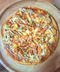 Delicious fresh baked Italian pizza with ham and mozzarella cheese on a plate, isolated on a white background