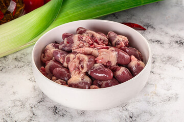 Raw chicken hearts in the bowl