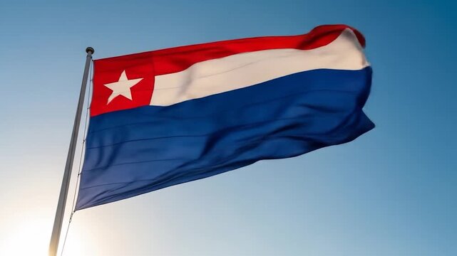 Flag of the State of Arauca, Colombia, waving against a clear blue sky in a video