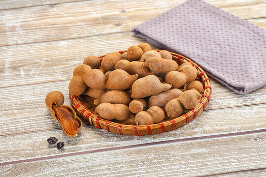 Tropical exotic Tamarind fruit heap