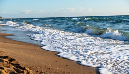 Obraz premium Waves crashing on sandy beach at sunset coastal landscape photography natural serenity outdoor viewpoint