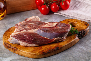Raw lamb steak with bone