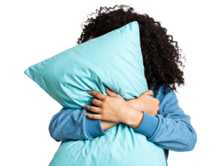 A person embracing a cushion, hair tied back in ponytail