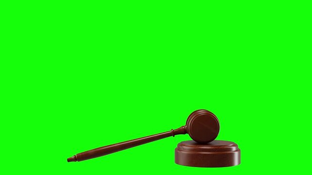 A wooden judge's gavel positioned on a green screen ideal for keying in video and animation projects