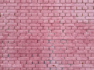 Brick wall painted pink white paint