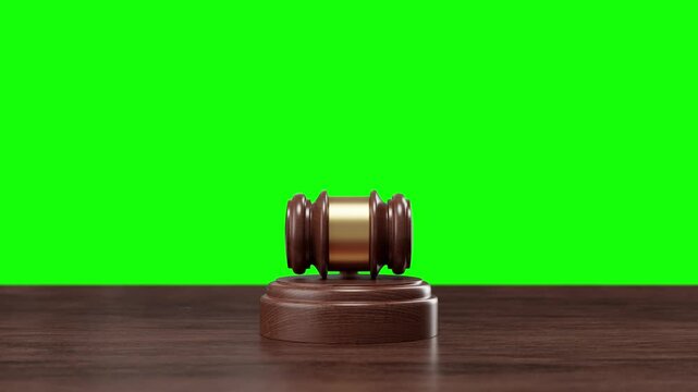 A wooden judge's gavel set against a green screen, ideal for keying in video and animation projects with 3d render elements