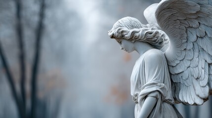 White marble angel statue with outstretched wings