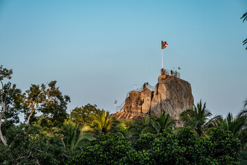 climbing on a rock in sri lanka, anouradhapura