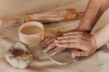 Clay modeling. Pottery. Woman kneading clay