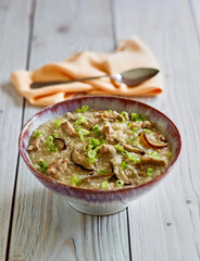 pork congee rice dish with mushrooms and green onion
